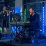 Composer Jacques Rautenbach performing live on stage, contributing to the Apparition movie soundtrack.